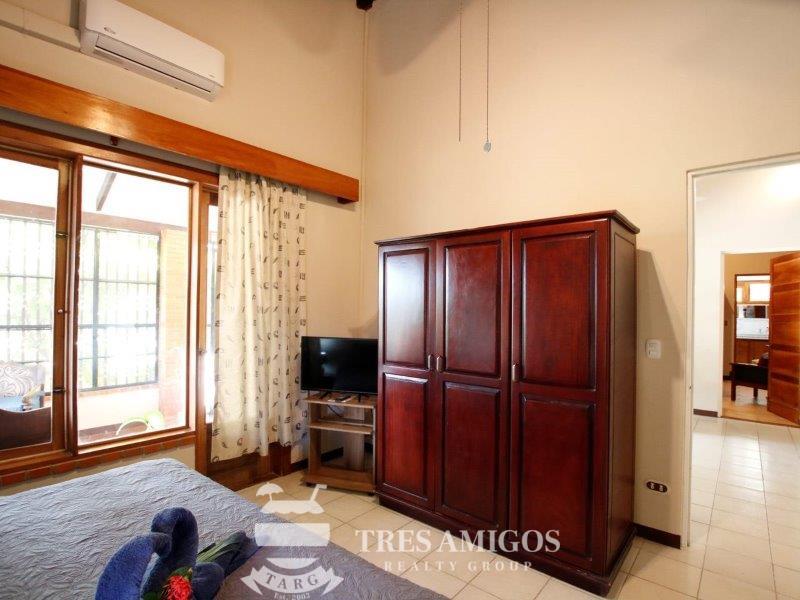Air conditioned bedroom with hard wood cabinet 