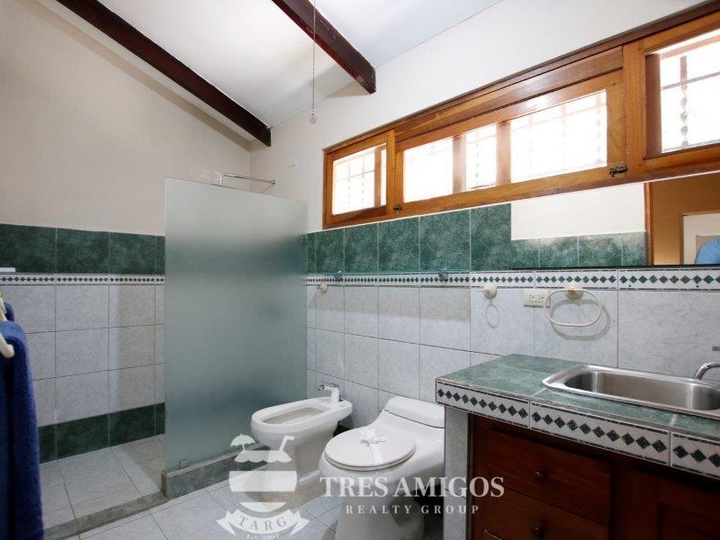 Bathroom with tiled wall and floor