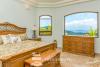 Ocean view bedroom with glass window 