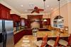 Kitchen sports granite counter tops with solid wood cabinets