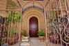 Entrance way with solid wood Pachote door and Wrought Iron Gate